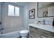 Elegant bathroom features subway tile, a modern vanity, and a well-lit mirror at 830 N Sherman St # 205, Denver, CO 80203
