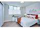 Cozy bedroom features a comfortable bed, a bright window, and stylish decorative accents at 830 N Sherman St # 205, Denver, CO 80203