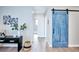 Light-filled hallway featuring modern décor and a stylish sliding door, creating a welcoming space at 830 N Sherman St # 205, Denver, CO 80203