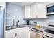 Modern kitchen featuring grey countertops and sleek stainless steel appliances at 830 N Sherman St # 205, Denver, CO 80203