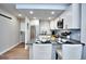Open concept kitchen with stainless steel appliances and island with barstool seating at 830 N Sherman St # 205, Denver, CO 80203