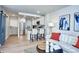 Open living area featuring bright interior, modern decor, and kitchen with counter seating at 830 N Sherman St # 205, Denver, CO 80203