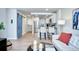 Charming living room open to kitchen, complete with a modern sliding door and breakfast bar seating at 830 N Sherman St # 205, Denver, CO 80203