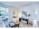 Bright living room with modern decor, balcony access and light hardwood flooring at 830 N Sherman St # 205, Denver, CO 80203
