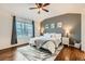 Serene main bedroom with a plush bed, a window view, and stylish decor at 1157 Mircos St, Erie, CO 80516