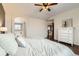 Comfortable bedroom featuring a white dresser and an open doorway with a view of the bathroom at 1157 Mircos St, Erie, CO 80516