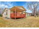 Backyard with covered wood deck and well-maintained lawn at 9693 W Euclid Dr, Littleton, CO 80123