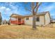 Exterior showing the siding of the house and a red deck at 9693 W Euclid Dr, Littleton, CO 80123