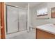 Bathroom with shower featuring sliding glass doors, vanity, and toilet at 9693 W Euclid Dr, Littleton, CO 80123