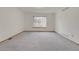 Large bedroom with neutral gray carpet, window for natural light, and heating vents at 9693 W Euclid Dr, Littleton, CO 80123