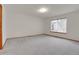 Expansive bedroom featuring carpeted floor and a window with blinds for natural light at 9693 W Euclid Dr, Littleton, CO 80123