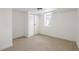 Clean, empty bedroom featuring neutral carpet, double sliding door closet, and a window at 2293 S Sherman St, Denver, CO 80210