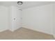 Bright and minimalist bedroom with neutral carpet, and a closet with sliding doors at 2293 S Sherman St, Denver, CO 80210