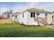 Attractive single-story home with white brick and a well-maintained green lawn at 2293 S Sherman St, Denver, CO 80210