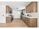 Spacious modern kitchen featuring wood cabinets, stainless steel appliances, and open layout at 2293 S Sherman St, Denver, CO 80210