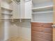 Walk-in closet with custom shelving and drawers for optimal organization at 3100 Huron St # 4N, Denver, CO 80202