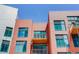 Exterior view of brick apartment building with private balconies at 3100 Huron St # 4N, Denver, CO 80202