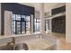 Modern kitchen with granite countertops and stainless steel appliances, leading to bright living space at 3100 Huron St # 4N, Denver, CO 80202