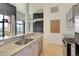 Modern kitchen with granite countertops and stainless steel appliances opens to a spacious living area at 3100 Huron St # 4N, Denver, CO 80202