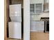 Convenient in-unit laundry area, near the kitchen and living spaces at 3100 Huron St # 4N, Denver, CO 80202