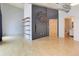 Stylish living room boasts hardwood floors, industrial ductwork, and wall-mounted bike rack, perfect for urban living at 3100 Huron St # 4N, Denver, CO 80202