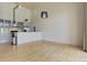 Bright and airy living room with light wood floors and high ceilings at 3100 Huron St # 4N, Denver, CO 80202