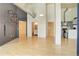 Bright living room with hardwood floors, industrial ductwork, and access to kitchen and bathroom at 3100 Huron St # 4N, Denver, CO 80202