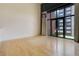 Living area with natural light, balcony access and neutral finishes at 3100 Huron St # 4N, Denver, CO 80202