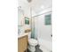 Stylish bathroom with black and white tile and updated fixtures at 3329 N High St, Denver, CO 80205