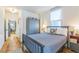 Bright bedroom featuring natural light, hard wood floors, and stylish decor at 3329 N High St, Denver, CO 80205