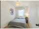 Cozy bedroom featuring natural lighting and a decorative wall at 3329 N High St, Denver, CO 80205