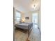 Cozy bedroom with hardwood floors, natural light, and neutral decor at 3329 N High St, Denver, CO 80205