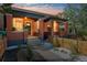 Charming brick duplex showcasing covered front porches and landscaped front yards with decorative white rock at 3329 N High St, Denver, CO 80205