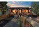 Stunning exterior view of a brick duplex with well-manicured landscaping and inviting porches at 3329 N High St, Denver, CO 80205