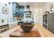 Contemporary kitchen with white subway tile backsplash, blue cabinets, and hardwood floors at 3329 N High St, Denver, CO 80205