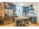 Bright kitchen featuring an island, stainless appliances, and custom cabinets at 3329 N High St, Denver, CO 80205