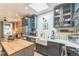 Modern kitchen with white subway tile, blue cabinets, butcher block island, and stainless appliances at 3329 N High St, Denver, CO 80205