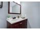 Bathroom with dark wood vanity, dark faucet and modern mirror at 4899 S Dudley St # 5H, Littleton, CO 80123