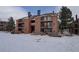 Exterior of home with balconies and green space at 4899 S Dudley St # 5H, Littleton, CO 80123