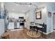 Well-lit kitchen featuring stainless steel appliances and eat-in dining area with modern lighting at 4899 S Dudley St # 5H, Littleton, CO 80123