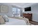 Main bedroom with walk-out balcony, dresser, and relaxing modern design at 4899 S Dudley St # 5H, Littleton, CO 80123