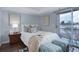 Cozy main bedroom with sliding door access to the outdoor balcony and ensuite at 4899 S Dudley St # 5H, Littleton, CO 80123