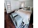 Bedroom with a blue and white carpet and a bed with soft pillows at 4899 S Dudley St # 5H, Littleton, CO 80123