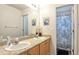 Bright bathroom features double sinks and a separate shower/tub at 6515 S Killarney Ct, Aurora, CO 80016