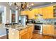 Modern kitchen with stainless steel appliances and an island at 6515 S Killarney Ct, Aurora, CO 80016