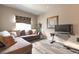 A cozy living room featuring modern furniture, neutral decor, and stylish hardwood floors for a contemporary feel at 6515 S Killarney Ct, Aurora, CO 80016