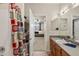Well-lit bathroom features a shower with patterned curtain, vanity, and bedroom access at 4100 Albion St # 424, Denver, CO 80216