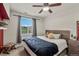 Bright bedroom with a ceiling fan and large window at 4100 Albion St # 424, Denver, CO 80216