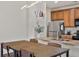 Eat in Kitchen featuring stainless steel appliances and pendant lighting at 4100 Albion St # 424, Denver, CO 80216