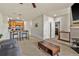 Open-concept living room featuring a breakfast bar and view of the stairway at 4100 Albion St # 424, Denver, CO 80216
